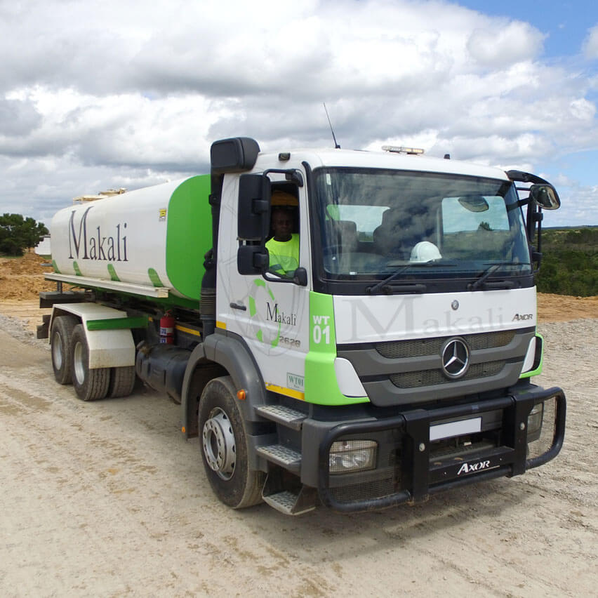 A truck featuring a distinctive green and white paint job, showcasing its vibrant and eye-catching design.